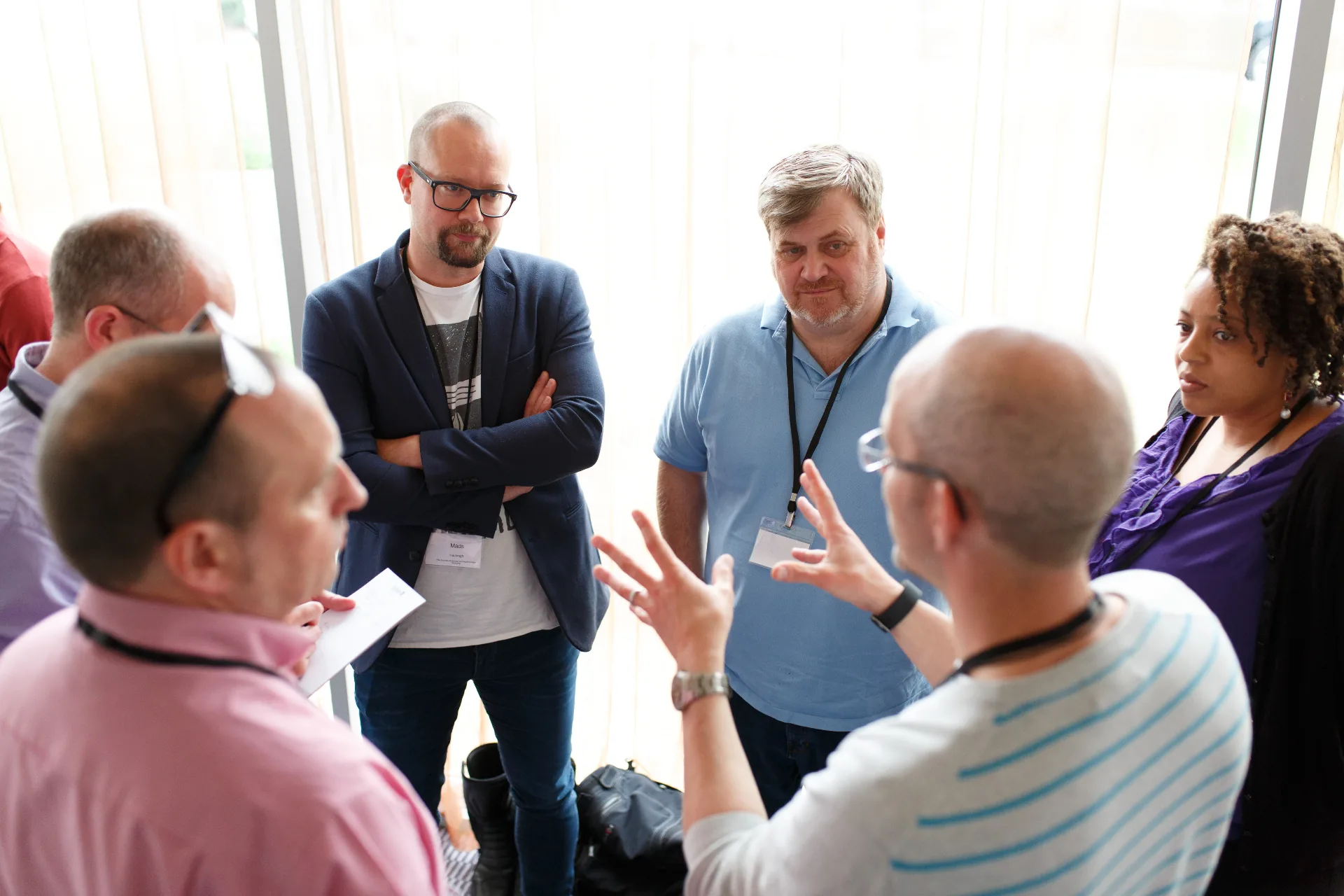 Small group of members in animated conversation