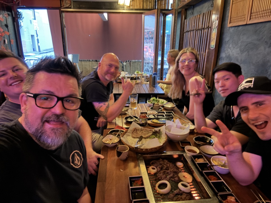 The group around a Korean barbecue table at a mastermind dinner