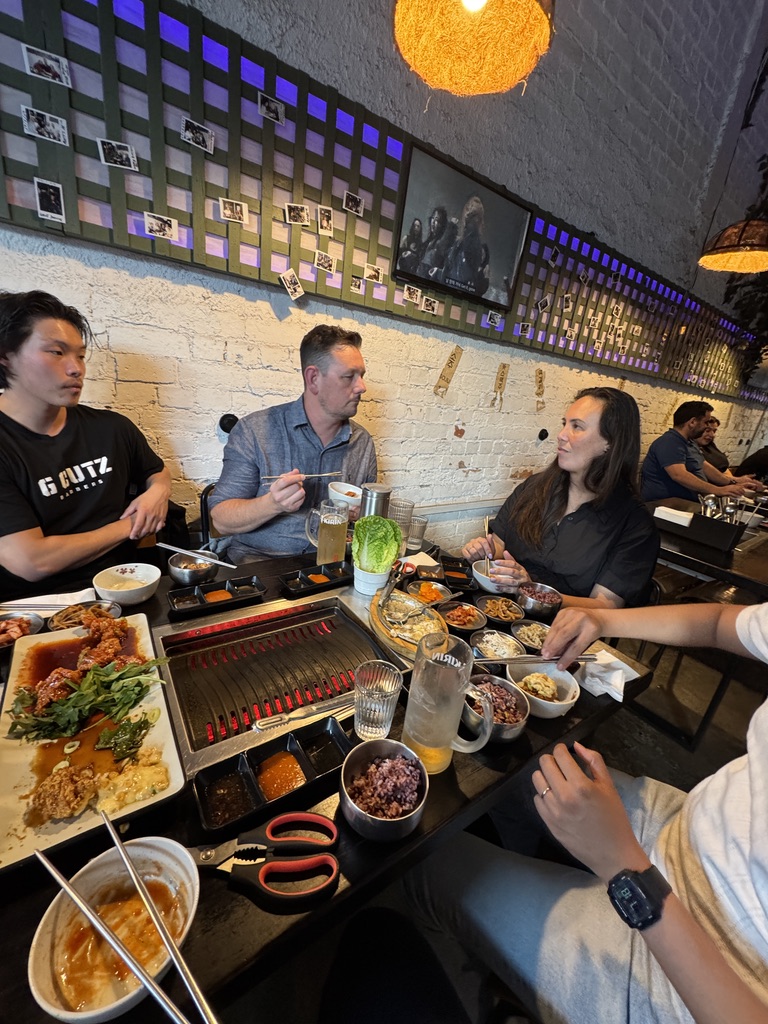 Members eating together at a long table