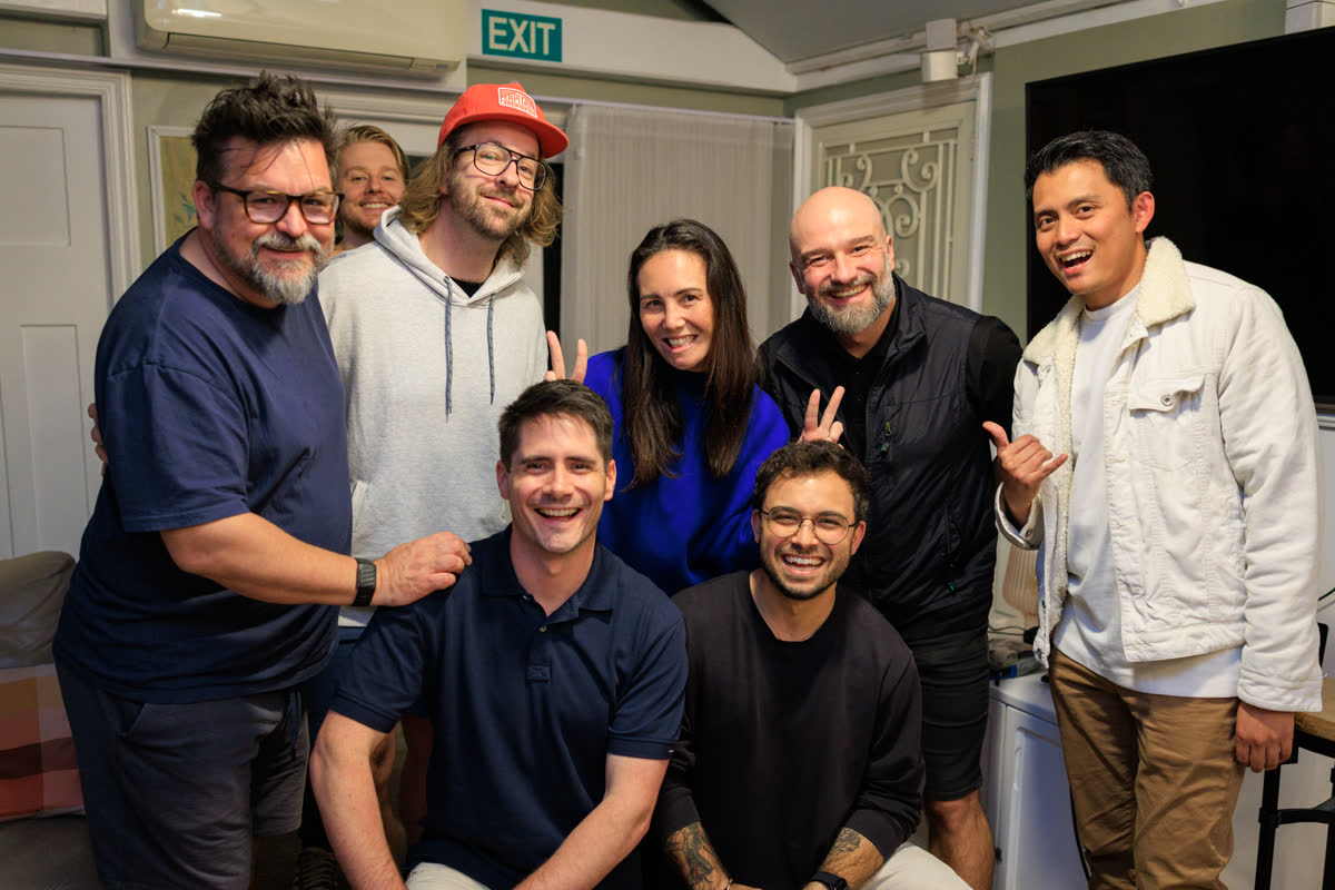 The group laughing together at the end of a day