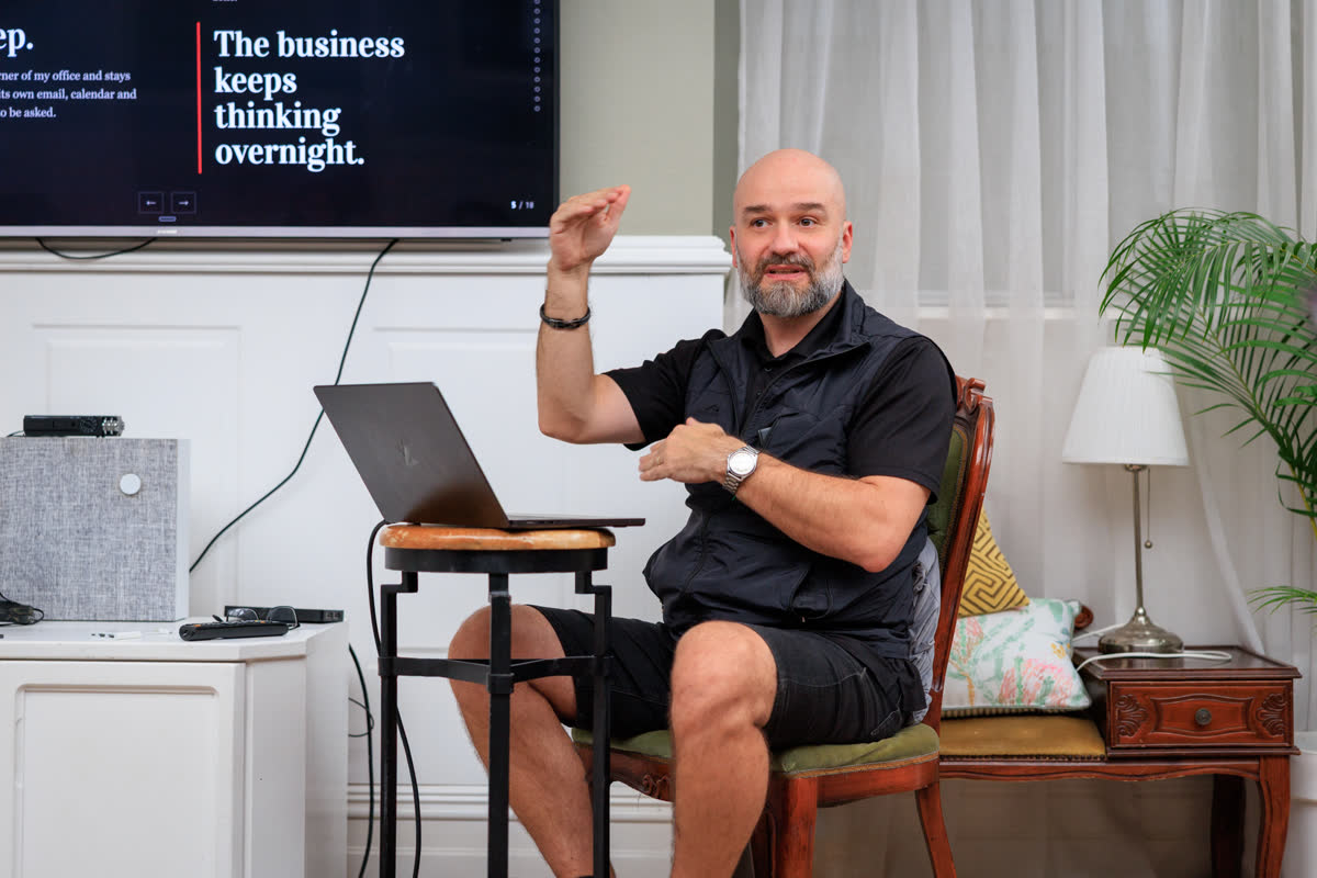 A session in front of the slide reading the business keeps thinking overnight